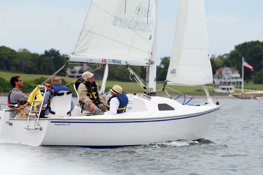 A group of people in a Freedom Independence sailboat