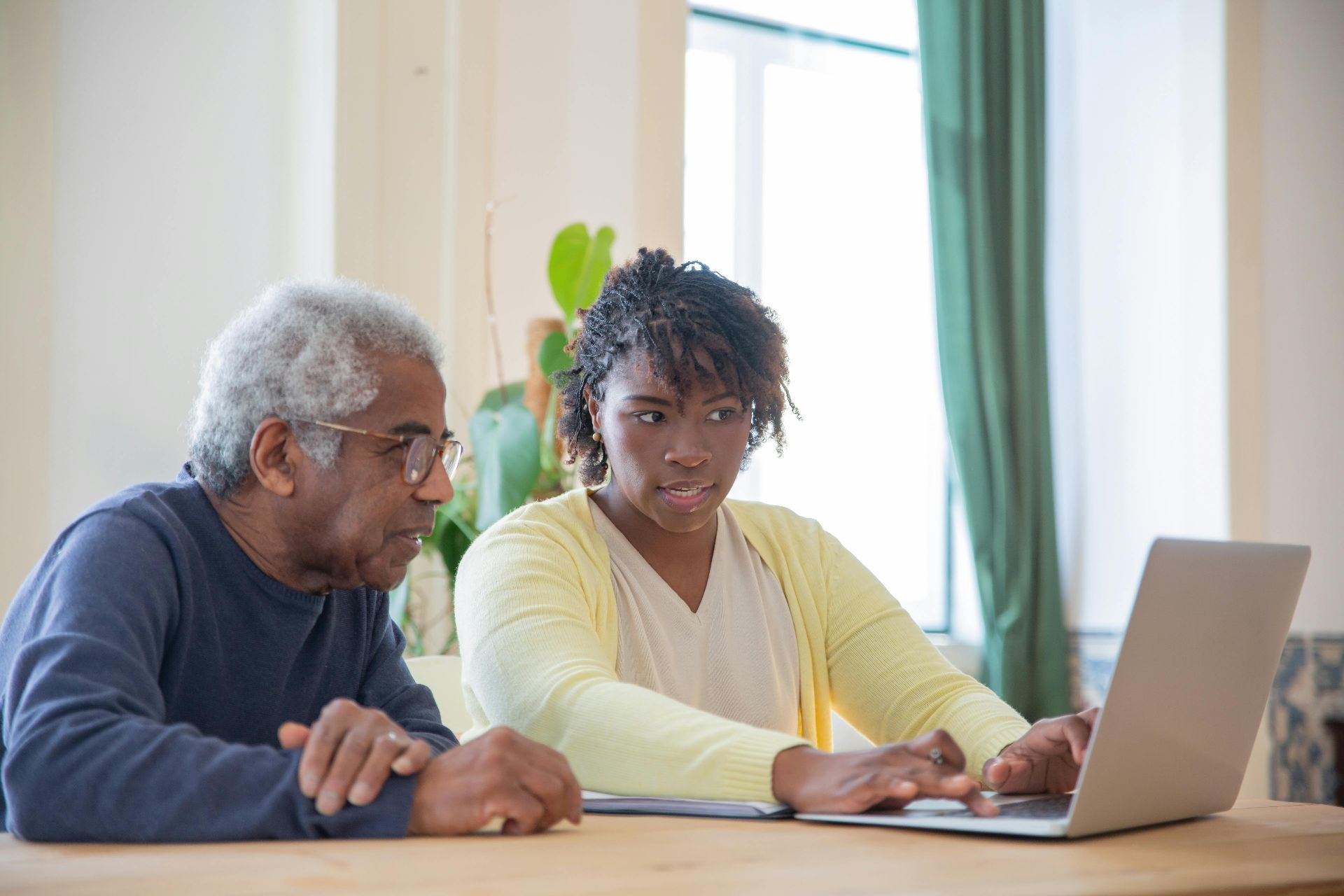 middle-aged-couple-looking-at-laptop